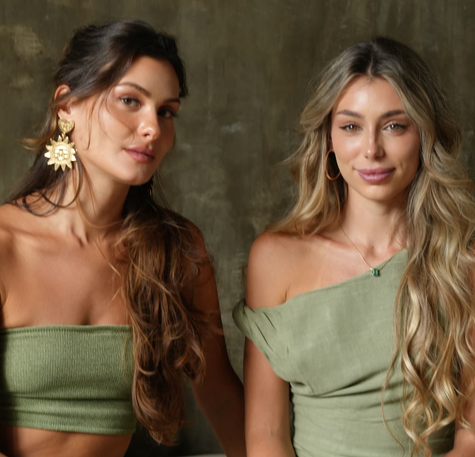 Jean and Julia side by side, both dressed in green