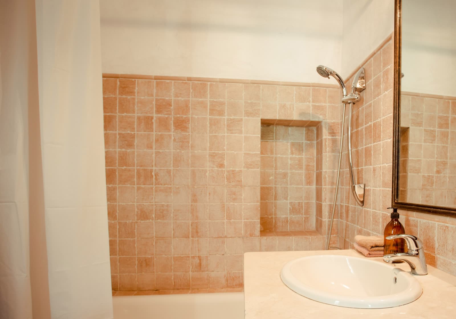 A bathroom with terracotta tiles